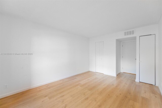 9601 Sunrise Lakes Blvd Unit 106, Sunrise, FL 33322 - unfurnished bedroom featuring light wood-style floors and baseboards