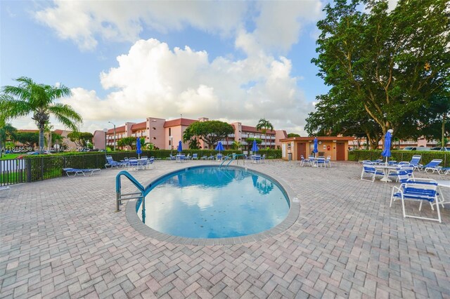 9601 Sunrise Lakes Blvd Unit 106, Sunrise, FL 33322 - community pool featuring a patio area