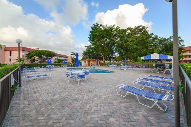 9601 Sunrise Lakes Blvd Unit 106, Sunrise, FL 33322 - view of pool featuring a patio area