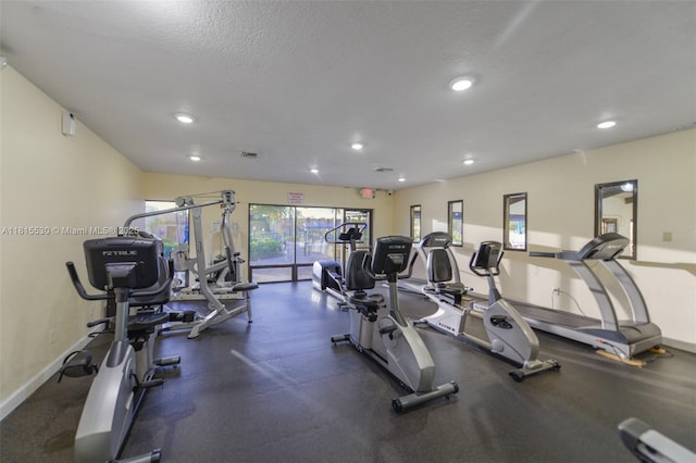 9601 Sunrise Lakes Blvd Unit 106, Sunrise, FL 33322 - workout area with recessed lighting, baseboards, and a textured ceiling