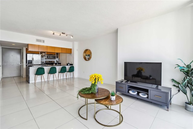 1750 N Bayshore Dr Unit 4604, Miami, FL 33132 - living room featuring light tile patterned floors and baseboards