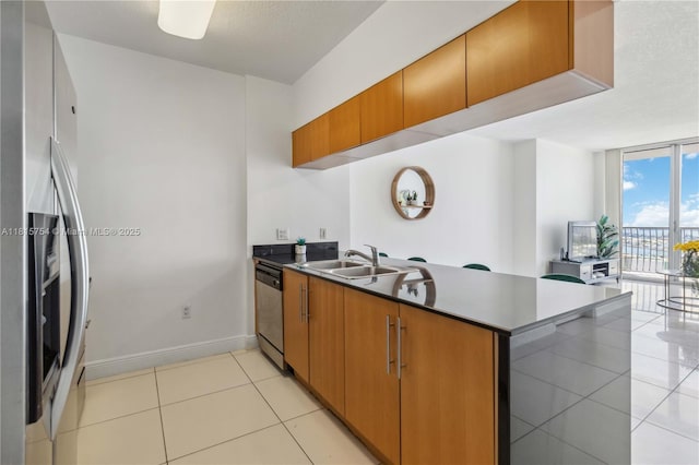 1750 N Bayshore Dr Unit 4604, Miami, FL 33132 - kitchen with stainless steel appliances, light tile patterned floors, a peninsula, brown cabinets, and floor to ceiling windows