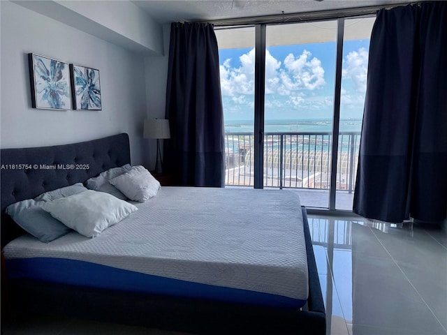 1750 N Bayshore Dr Unit 4604, Miami, FL 33132 - tiled bedroom featuring expansive windows, access to outside, and a water view