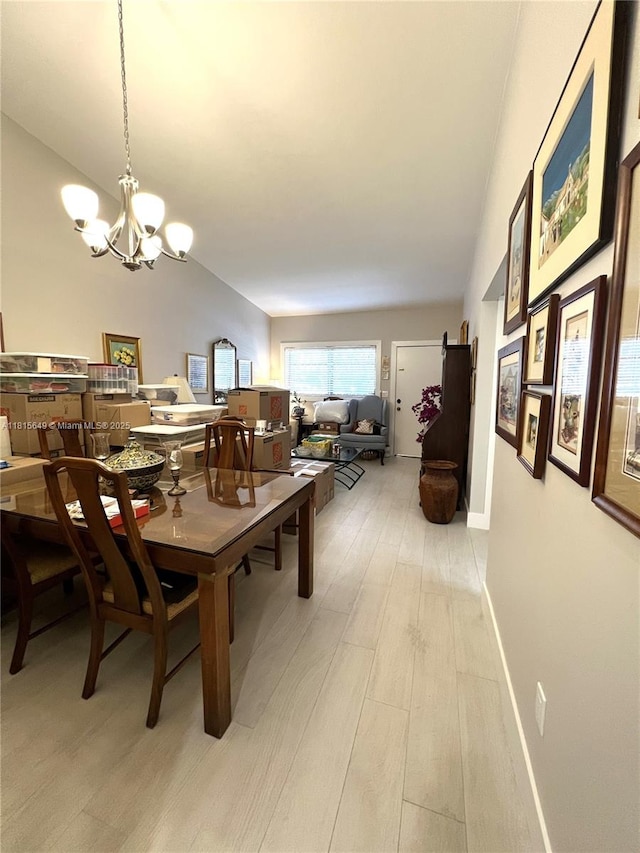 10830 SW 72nd St Unit 14, Miami, FL 33173 - dining area featuring a chandelier and light wood finished floors