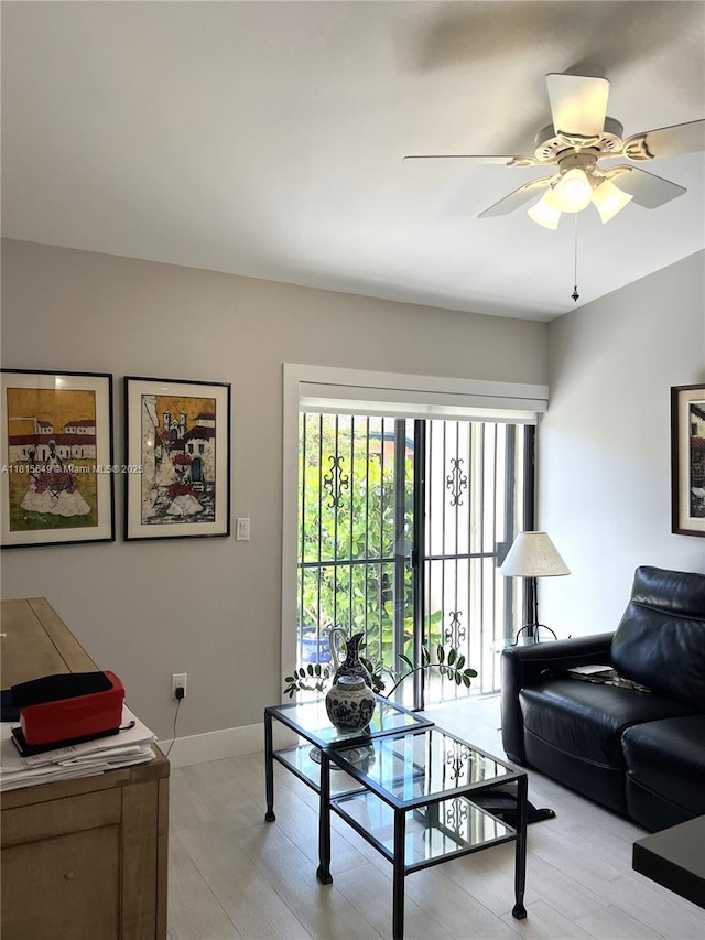 10830 SW 72nd St Unit 14, Miami, FL 33173 - living area featuring baseboards and a ceiling fan