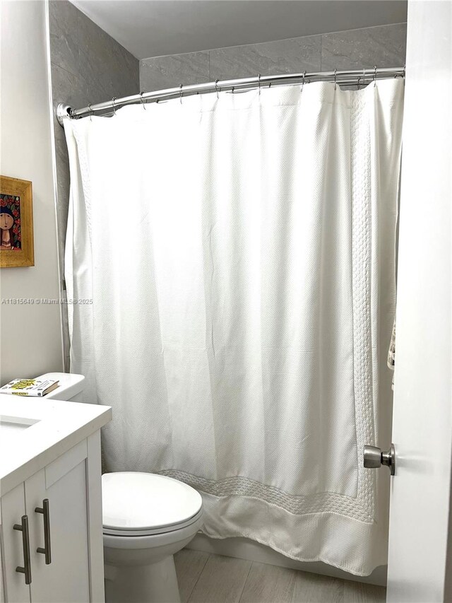 10830 SW 72nd St Unit 14, Miami, FL 33173 - bathroom featuring vanity, toilet, tile patterned flooring, and a shower with shower curtain