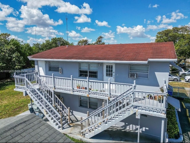 4130 SW 20th St, West Park, FL 33023 - back of house with stairway, stucco siding, a shingled roof, and a wooden deck