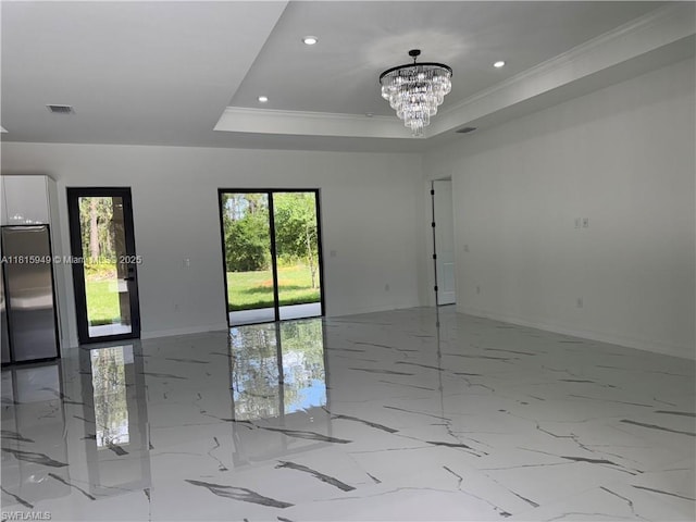 1016 Magnolia Ave, Lehigh Acres, FL 33974 - empty room featuring baseboards, light marble finish floors, a chandelier, recessed lighting, and a raised ceiling
