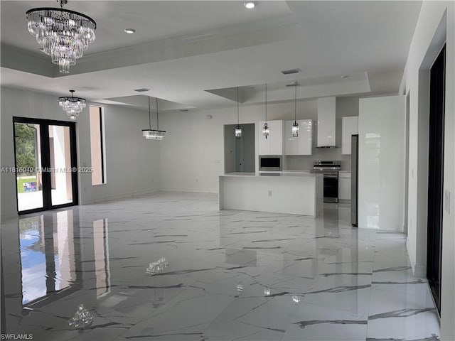 1016 Magnolia Ave, Lehigh Acres, FL 33974 - unfurnished living room with a raised ceiling, a chandelier, light marble finish floors, baseboards, and recessed lighting