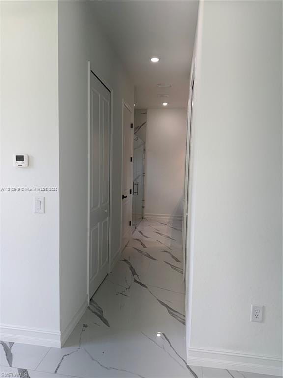 1016 Magnolia Ave, Lehigh Acres, FL 33974 - hall with baseboards, marble finish floors, and recessed lighting
