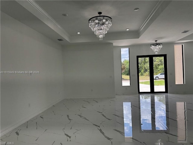 1016 Magnolia Ave, Lehigh Acres, FL 33974 - spare room with a chandelier, baseboards, marble finish floors, a tray ceiling, and recessed lighting
