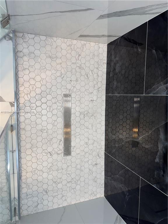 1016 Magnolia Ave, Lehigh Acres, FL 33974 - bathroom view of a tile shower