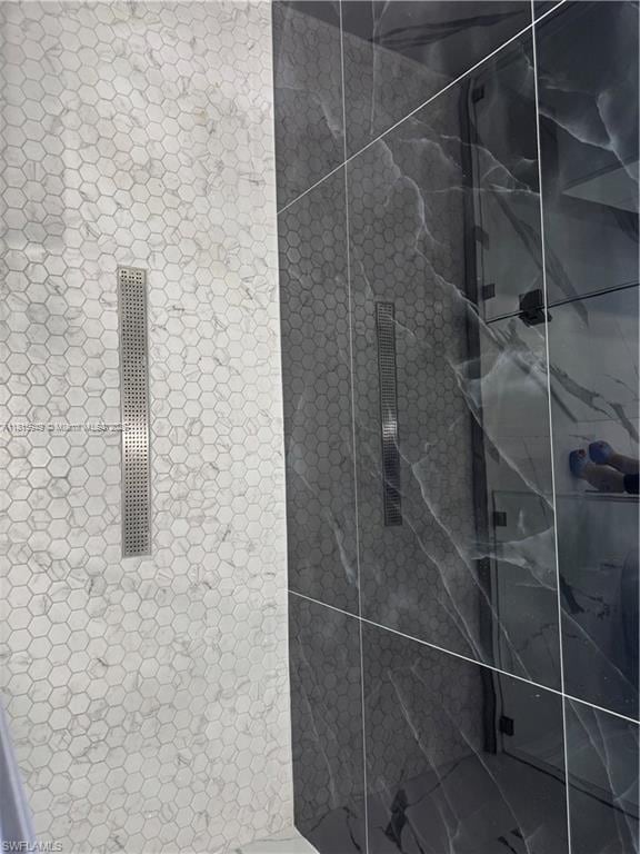1016 Magnolia Ave, Lehigh Acres, FL 33974 - bathroom view of a marble finish shower