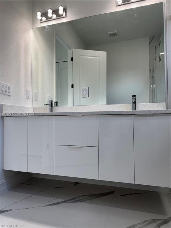 1016 Magnolia Ave, Lehigh Acres, FL 33974 - bathroom with double vanity and an enclosed shower