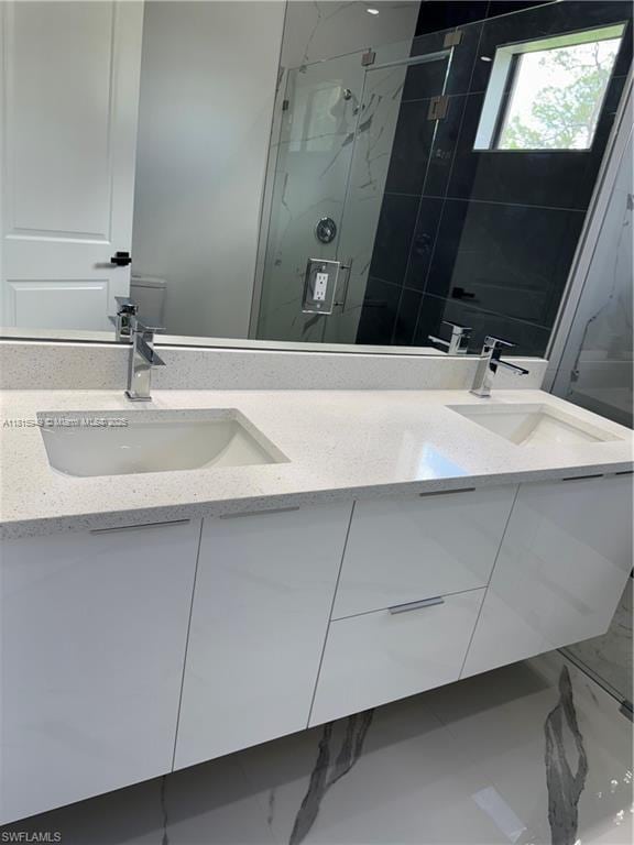 1016 Magnolia Ave, Lehigh Acres, FL 33974 - bathroom with marble look tiles, a marble finish shower, and double vanity