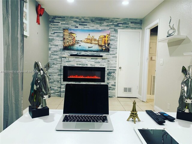 6309 Wiley St, Hollywood, FL 33023 - living room featuring a tile fireplace, light tile patterned floors, and recessed lighting