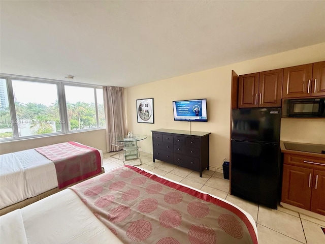 19201 Collins Ave Unit 242, Sunny Isles Beach, FL 33160 - bedroom featuring freestanding refrigerator and light tile patterned floors