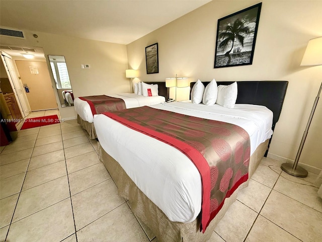 19201 Collins Ave Unit 242, Sunny Isles Beach, FL 33160 - bedroom featuring light tile patterned flooring and baseboards