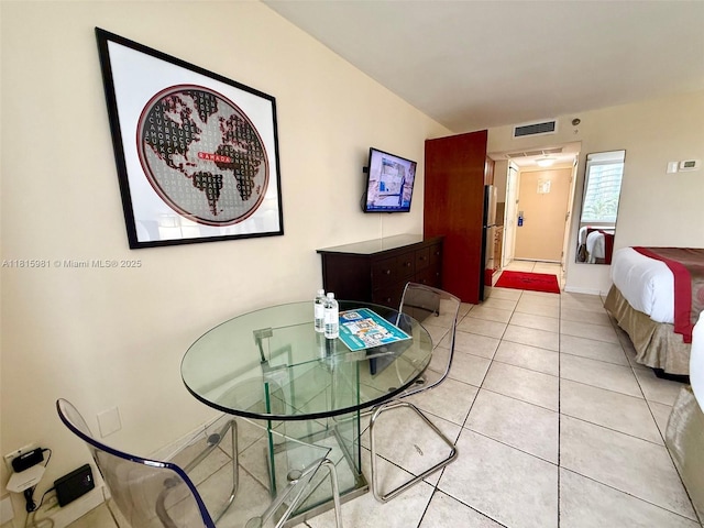 19201 Collins Ave Unit 242, Sunny Isles Beach, FL 33160 - dining space with light tile patterned floors and baseboards