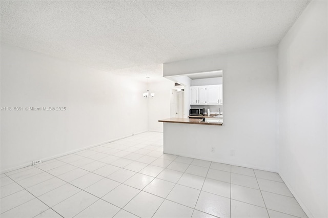4007 Durham A 4007, Deerfield Beach, FL 33442 - spare room with a textured ceiling