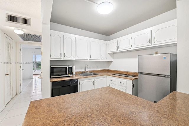 4007 Durham A 4007, Deerfield Beach, FL 33442 - kitchen featuring stainless steel appliances, a sink, light tile patterned floors, and white cabinets