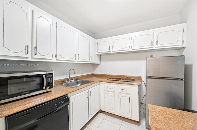 4007 Durham A 4007, Deerfield Beach, FL 33442 - kitchen with stainless steel appliances, a sink, white cabinetry, light tile patterned floors, and light countertops