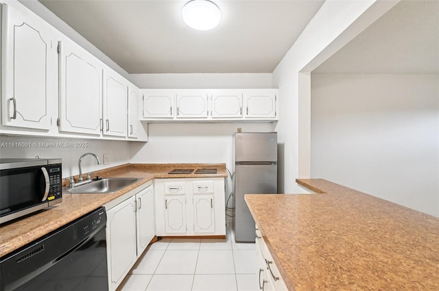 4007 Durham A 4007, Deerfield Beach, FL 33442 - kitchen with a sink, black appliances, white cabinets, light tile patterned floors, and light countertops
