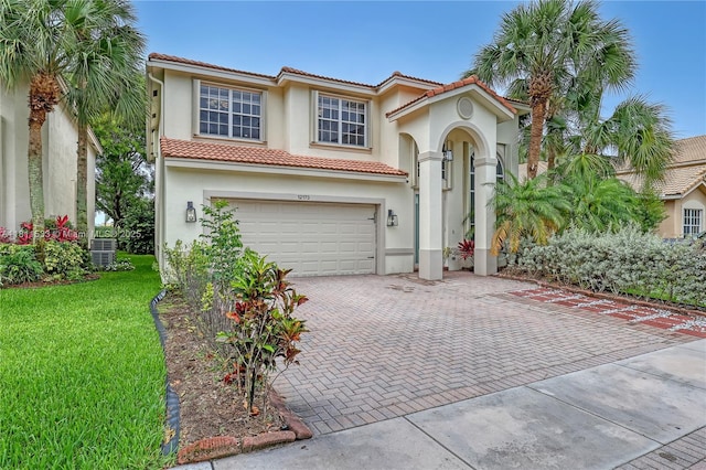 12173 Colony Preserve Dr, Boynton Beach, FL 33436 - mediterranean / spanish-style house featuring stucco siding, a garage, a tiled roof, and decorative driveway
