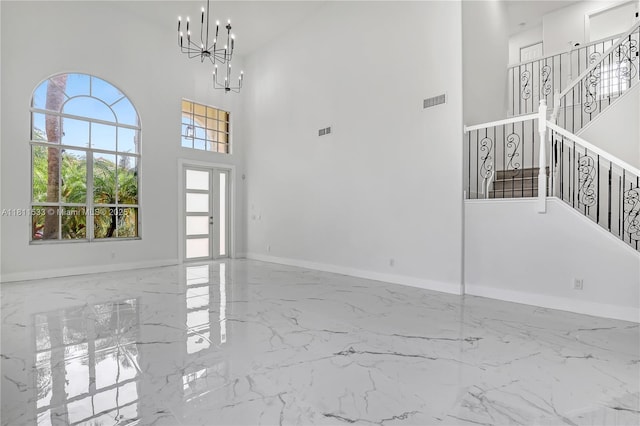 12173 Colony Preserve Dr, Boynton Beach, FL 33436 - foyer with marble tiled floors, a chandelier, and a towering ceiling