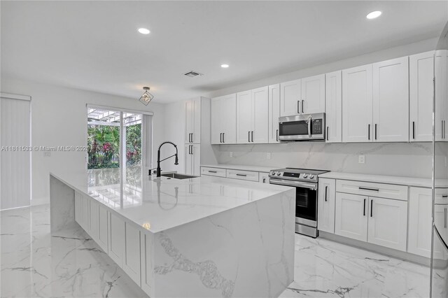 12173 Colony Preserve Dr, Boynton Beach, FL 33436 - kitchen with stainless steel appliances, recessed lighting, light marble finish flooring, a large island, and white cabinets