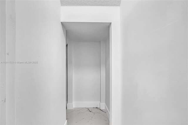 12173 Colony Preserve Dr, Boynton Beach, FL 33436 - hallway with marble finish flooring and a textured ceiling