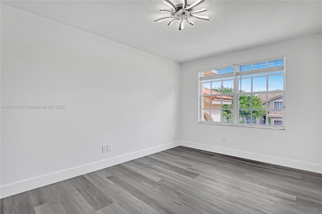 12173 Colony Preserve Dr, Boynton Beach, FL 33436 - spare room featuring dark wood-type flooring and a textured ceiling