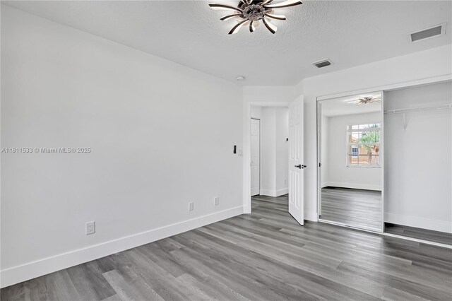 12173 Colony Preserve Dr, Boynton Beach, FL 33436 - spare room with ceiling fan, wood finished floors, a textured ceiling, and a smoke detector