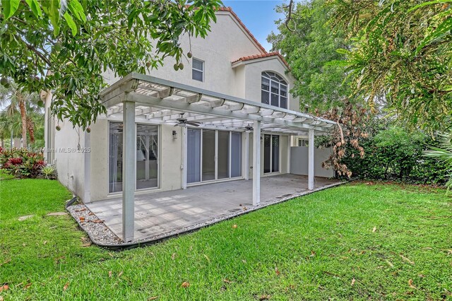12173 Colony Preserve Dr, Boynton Beach, FL 33436 - rear view of house with a pergola, a lawn, stucco siding, and a patio area
