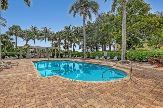 12173 Colony Preserve Dr, Boynton Beach, FL 33436 - community pool with a pergola and a patio area