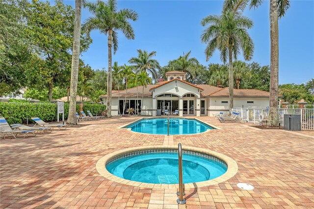 12173 Colony Preserve Dr, Boynton Beach, FL 33436 - community pool with a hot tub, a patio, and french doors