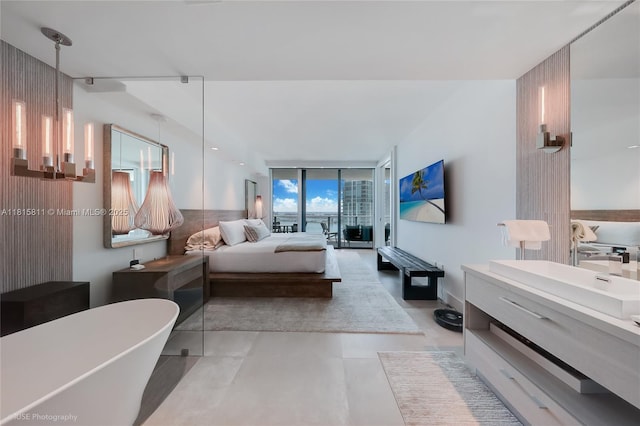 650 NE 32nd St Unit 4701, Miami, FL 33137 - bedroom featuring light tile patterned floors and floor to ceiling windows