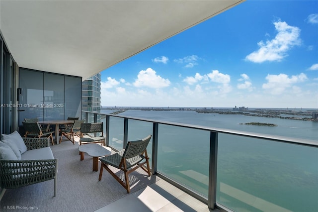 650 NE 32nd St Unit 4701, Miami, FL 33137 - balcony featuring a water view and outdoor lounge area