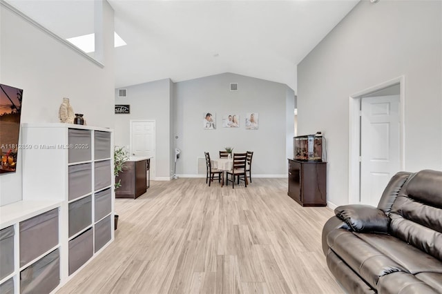 3059 Dogwood Ln, Margate, FL 33063 - living area featuring vaulted ceiling, light wood-style flooring, and baseboards