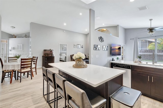 3059 Dogwood Ln, Margate, FL 33063 - kitchen featuring stainless steel dishwasher, a sink, lofted ceiling, a kitchen island, and light countertops