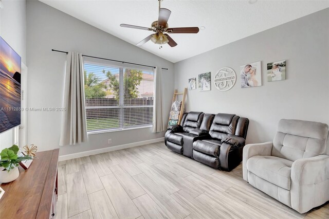 3059 Dogwood Ln, Margate, FL 33063 - living area featuring lofted ceiling, ceiling fan, light wood-type flooring, and baseboards