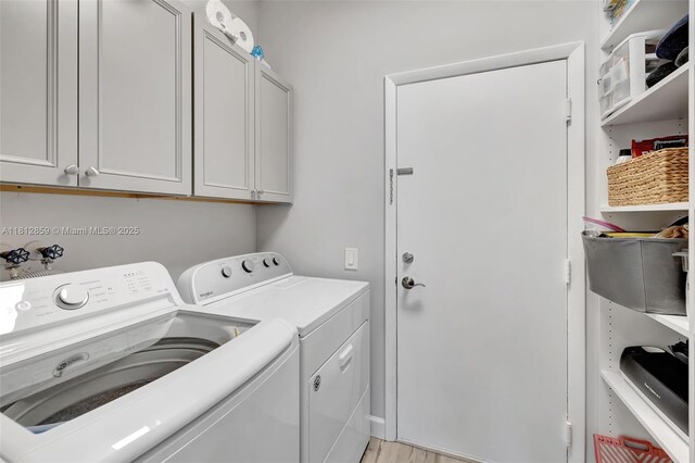 3059 Dogwood Ln, Margate, FL 33063 - laundry room with cabinet space, separate washer and dryer, and light wood-style flooring