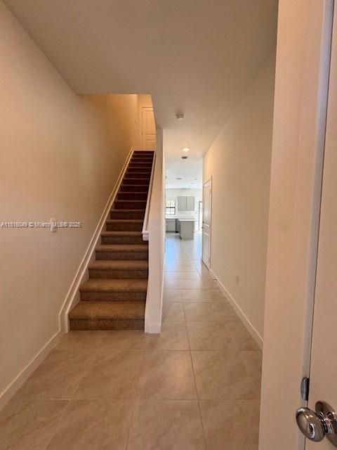 605 NW 6th Ter, Florida City, FL 33034 - stairway with tile patterned floors and baseboards