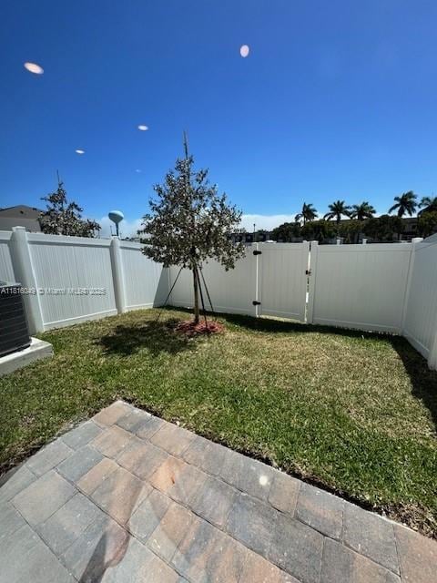 605 NW 6th Ter, Florida City, FL 33034 - view of yard with a patio and central AC