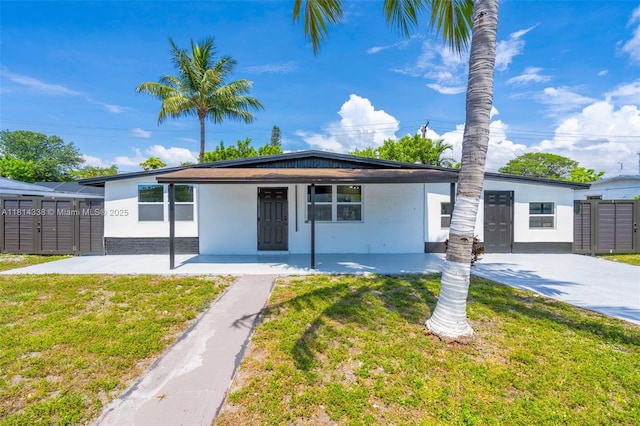 19330 NE 2nd Ave, Miami, FL 33179 - view of front facade featuring a front lawn, a porch, and stucco siding
