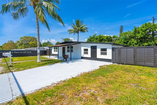 19330 NE 2nd Ave, Miami, FL 33179 - view of front facade featuring concrete driveway and stucco siding