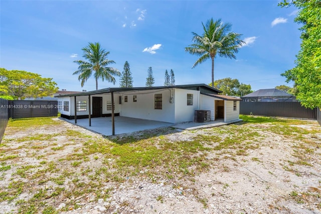 19330 NE 2nd Ave, Miami, FL 33179 - rear view of house with central AC unit, a patio area, an attached carport, and stucco siding