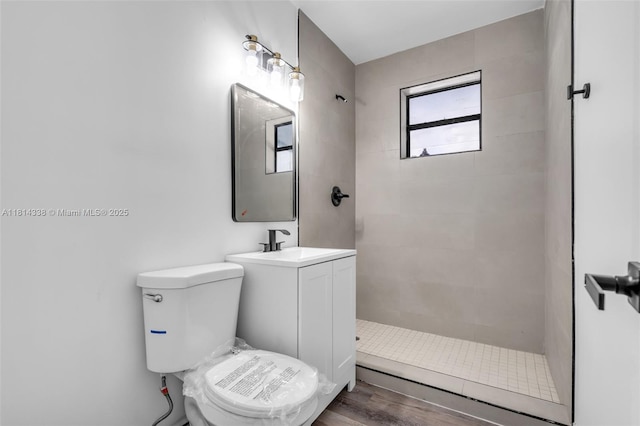 19330 NE 2nd Ave, Miami, FL 33179 - bathroom with tiled shower, toilet, vanity, and wood finished floors