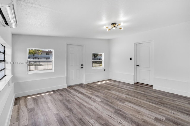 19330 NE 2nd Ave, Miami, FL 33179 - entryway with a chandelier, wood finished floors, and baseboards