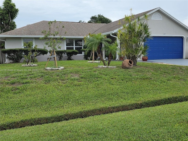 117 SW Fairview Ave, Port St Lucie, FL 34983 - single story home with concrete driveway, a garage, a front yard, and stucco siding